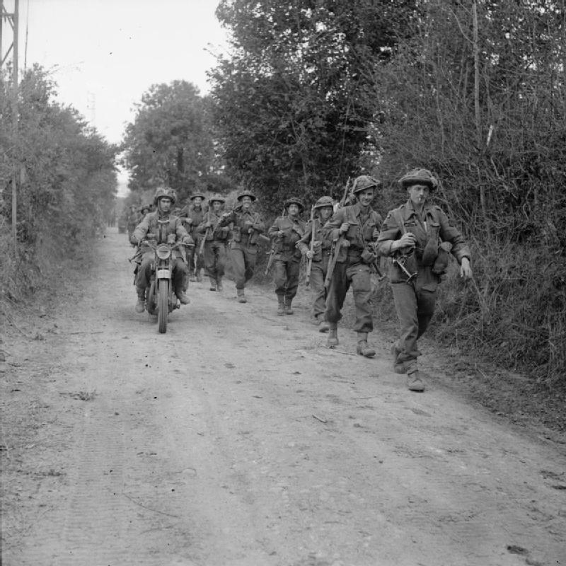 A motorcycle and infantry of the 2nd Glasgow H...