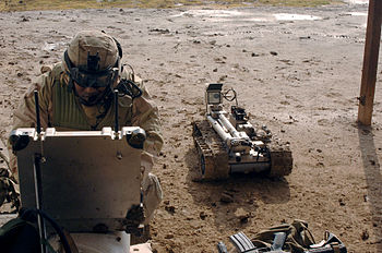 Military robot being prepared to inspect a bomb Military robot being prepared to inspect a bomb