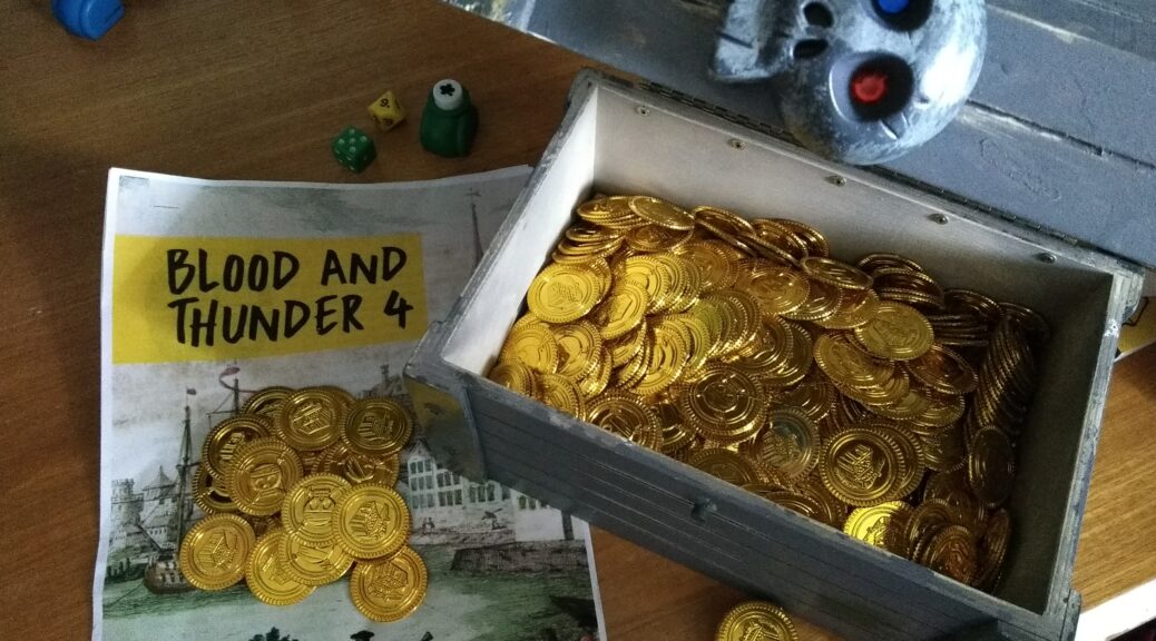 Briefing for Blood and Thunder 4 megagame and a wooden treasure chest filled with gold coins