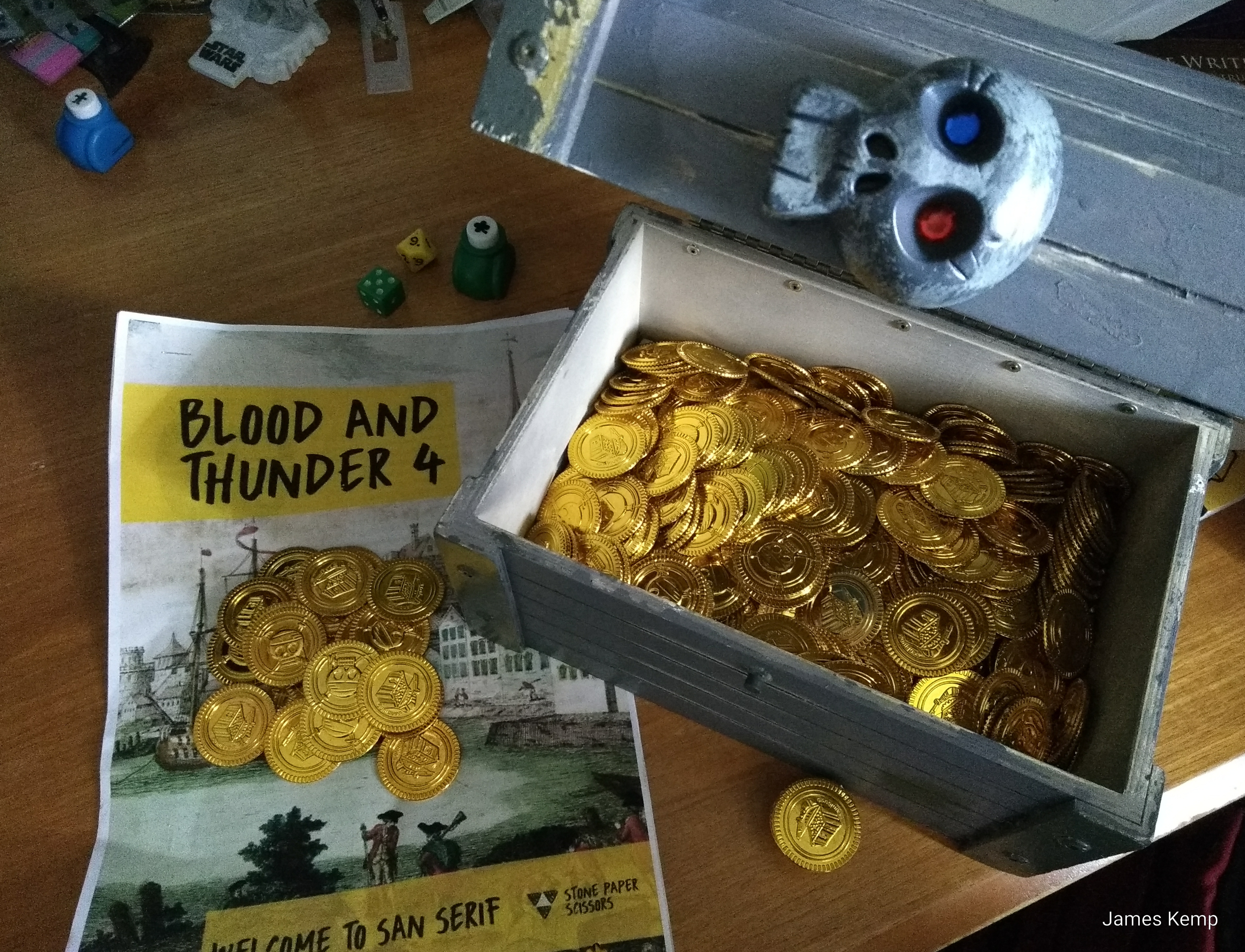 Briefing for Blood and Thunder 4 megagame and a wooden treasure chest filled with gold coins